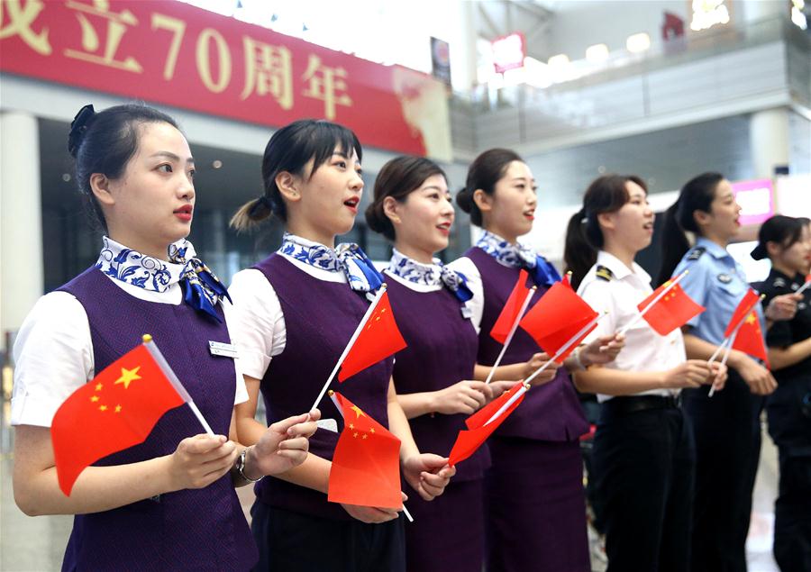 People Take Part in Flash Mob in Shanghai to Celebrate 70th 